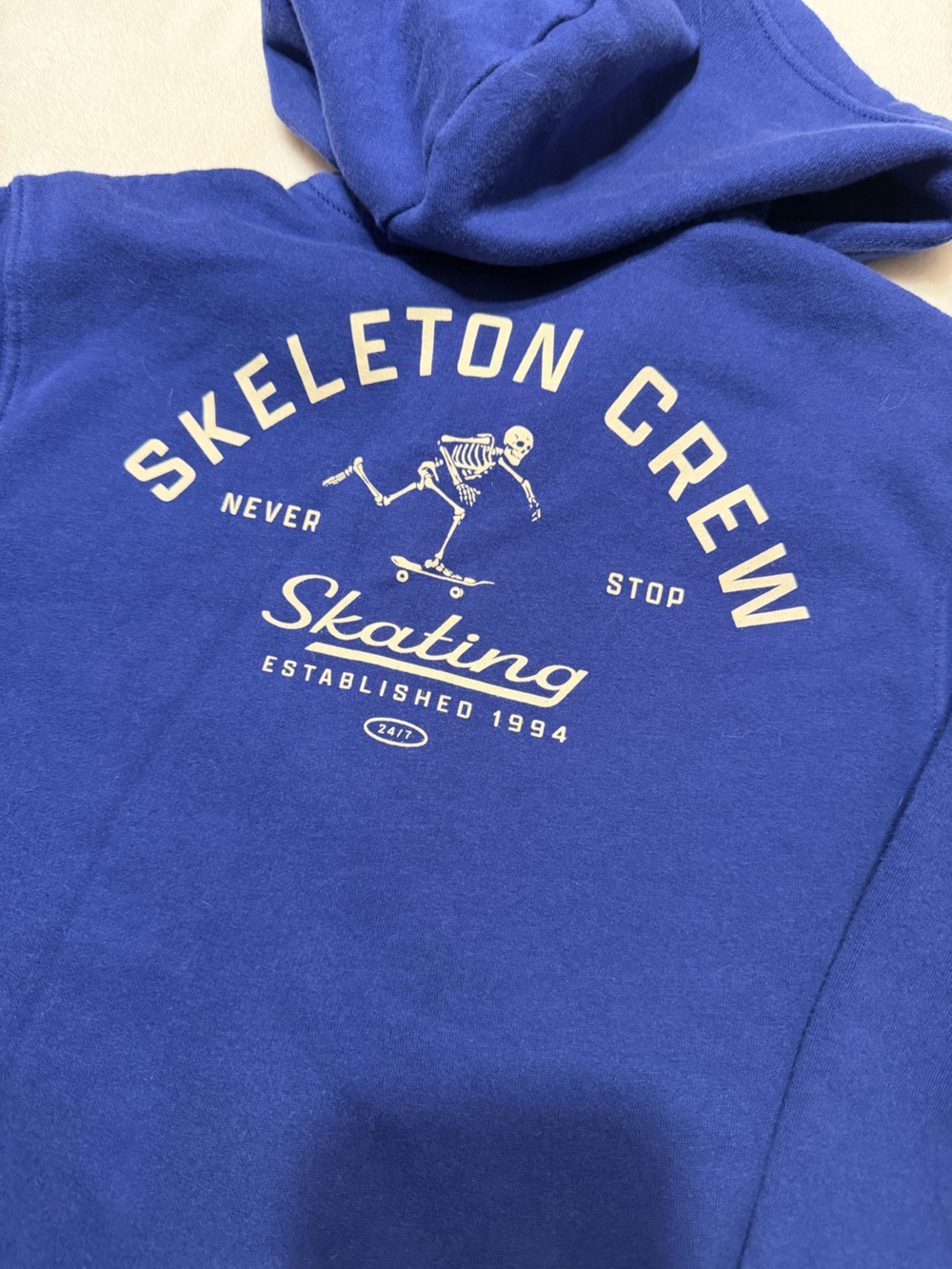 3/$15 | Blue Zip-Up Hoodie with Skeleton Skate Graphic - Picture 3 of 7